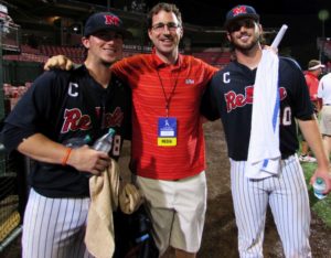 Captains Austin Anderson (L) and Will Allen (R) celebrate the victory over ULL with Ole Miss Assoc. Director of Media and Public Relations.