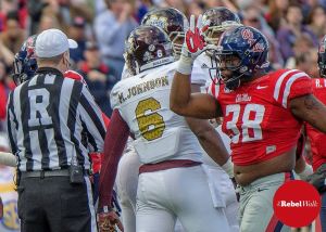 A leader on and off the field, Rebel linebacker Deterrian Shackelford throws up a landshark against State. (Photo credit: Bentley Breland)