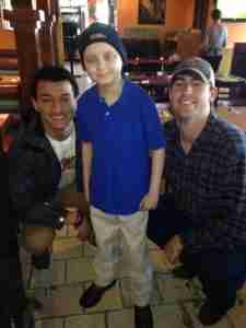 Chance frequently enjoyed time with Rebel players Evan Engram (L) and Ryan Buchanan (R). The two would later be pall bearers at Chance's funeral. (Photo courtesy of the Tetrick Family.)