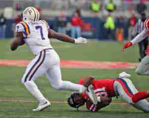 DeMarquis Gates tackles Leonard Fournette in the Rebels' 38-17 win. (Photo credit; Joshua McCoy, Ole Miss Athletics)