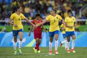 Soccer: 2016 Summer Olympics: Brazil Rafaelle (4) victorious with Monica (3) vs China during Women's Group Stage - Group E match at Olympic Stadium. Rio de Janeiro, Brazil 8/3/2016 (Photo credit: Donald Miralle)