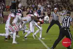 The Landshark defense swarms to the ball, carried here by Aggie QB Jake Hubenak. (Photo credit: Dan Anderson, The Rebel Walk)